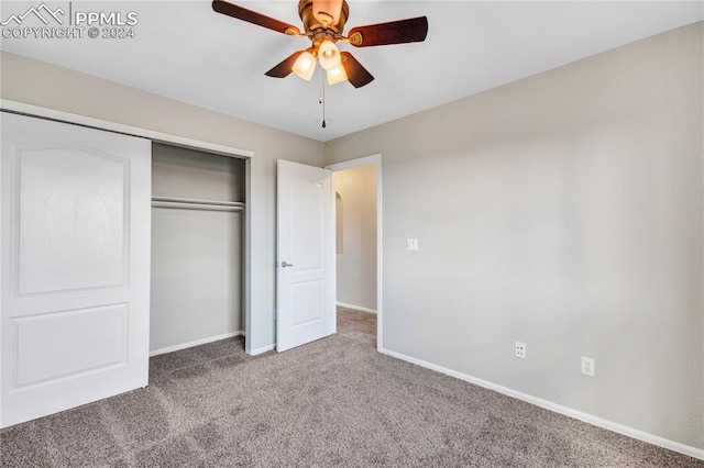 unfurnished bedroom with a closet, carpet flooring, and ceiling fan