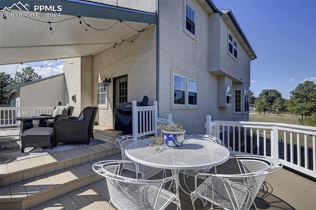 view of patio / terrace featuring a wooden deck