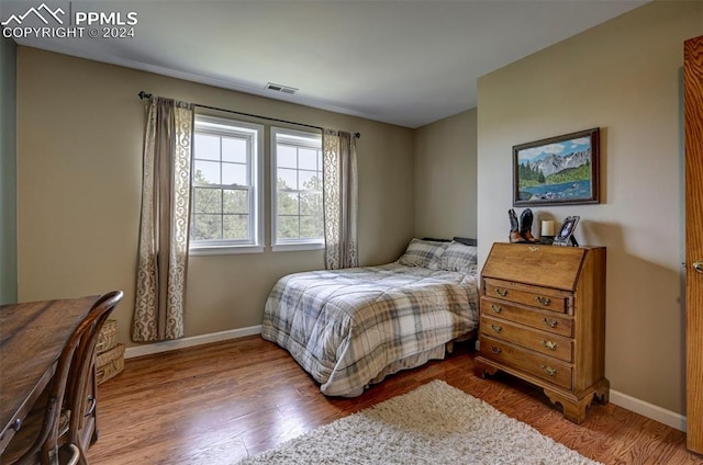 bedroom featuring hardwood / wood-style floors