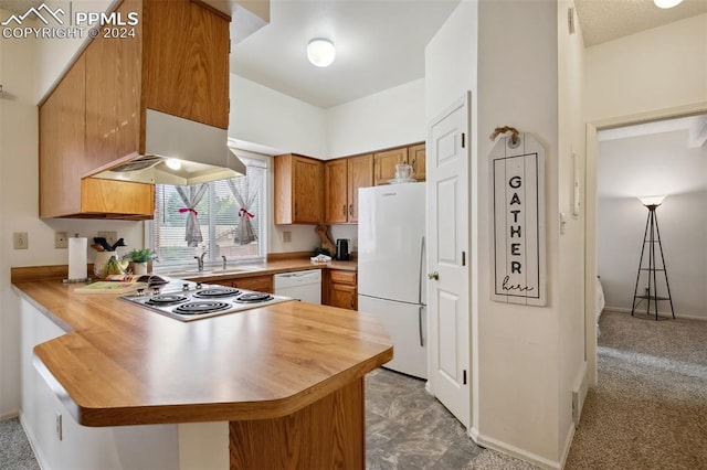 kitchen featuring white appliances, extractor fan, kitchen peninsula, and light colored carpet