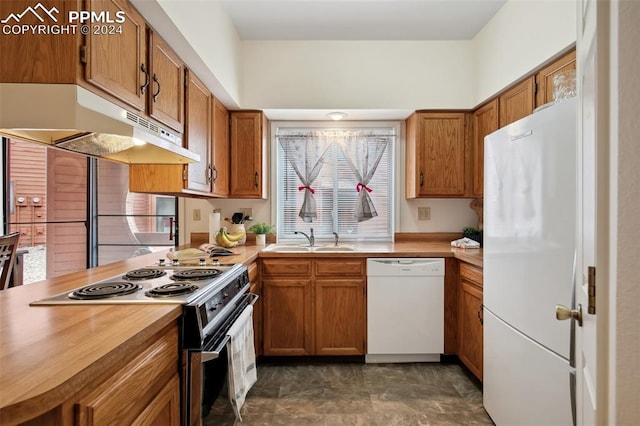 kitchen with sink and white appliances