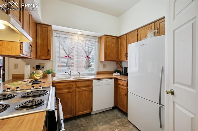 kitchen featuring sink and white appliances