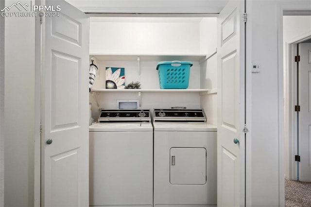 laundry area with washing machine and dryer