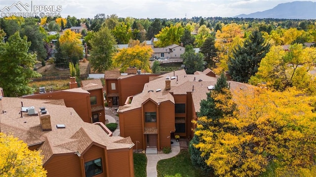 birds eye view of property with a mountain view