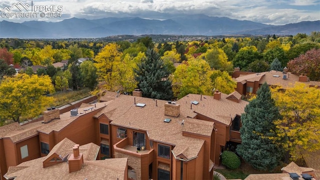 birds eye view of property with a mountain view