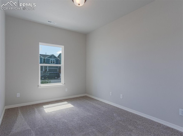 unfurnished room featuring carpet floors