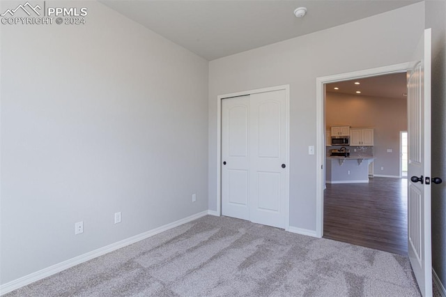 unfurnished bedroom with carpet floors