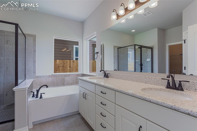 bathroom with vanity, separate shower and tub, and tile patterned flooring