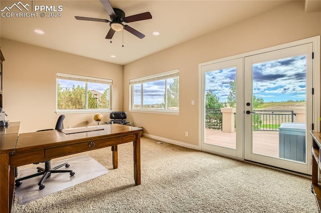 carpeted office space with french doors and ceiling fan