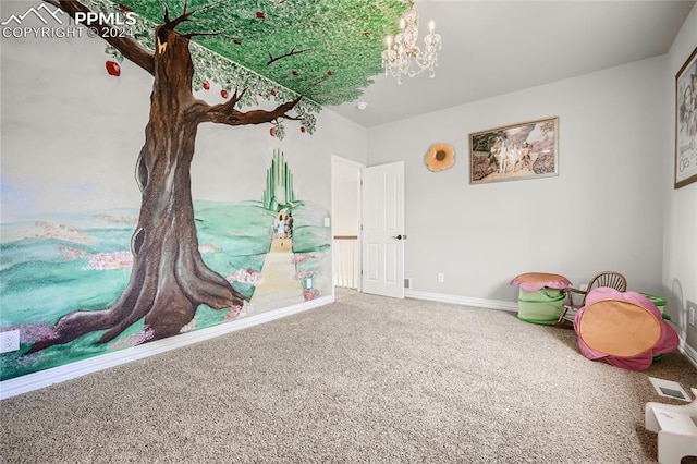 recreation room with a notable chandelier and carpet floors