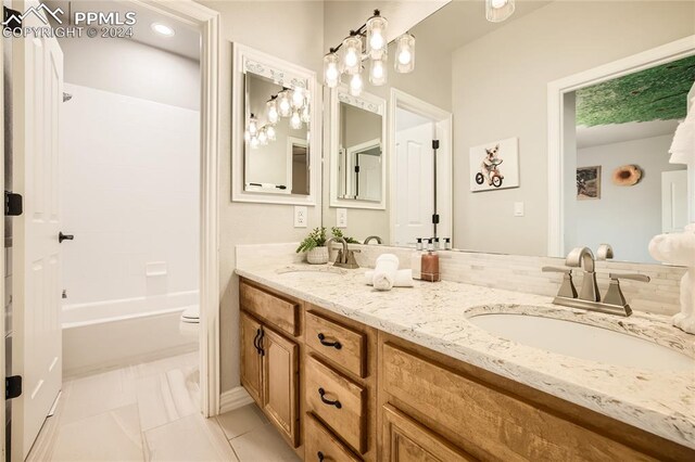 full bathroom with vanity, toilet, and tub / shower combination