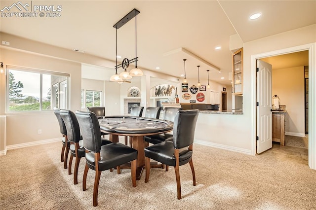 dining area with light colored carpet