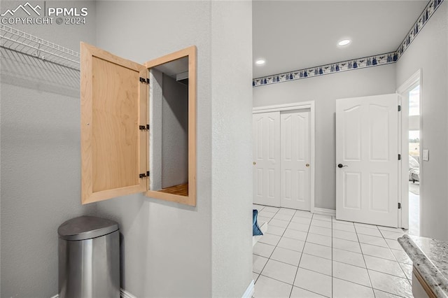 interior space featuring light tile patterned floors