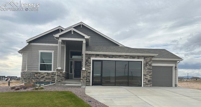 view of front of house with a front lawn and a garage