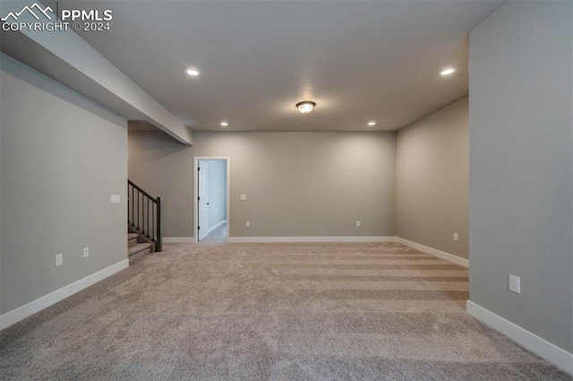 empty room featuring light colored carpet