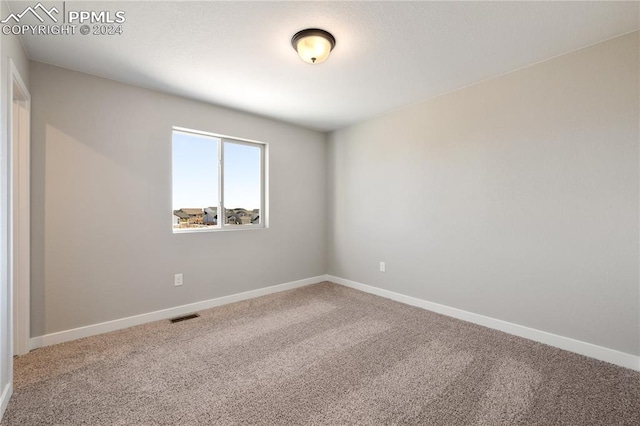 unfurnished room with carpet floors