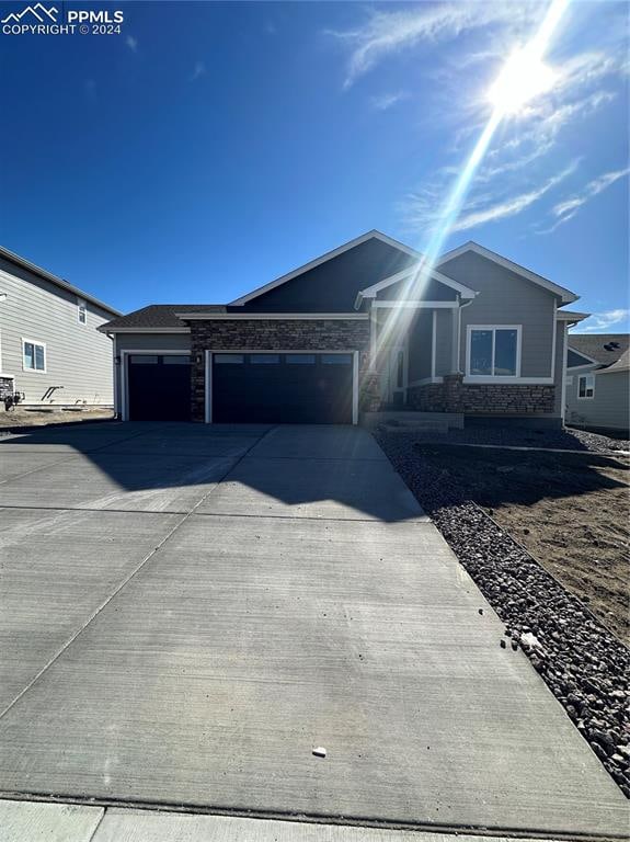 ranch-style house featuring a garage