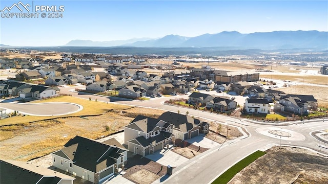 birds eye view of property featuring a mountain view