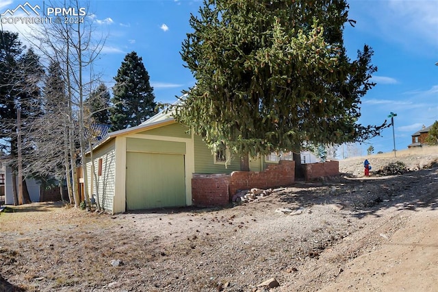 view of side of property with a garage