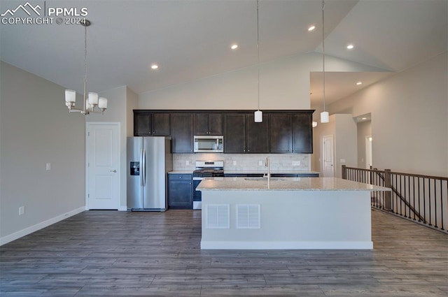 kitchen with dark hardwood / wood-style floors, a kitchen island with sink, stainless steel appliances, and high vaulted ceiling