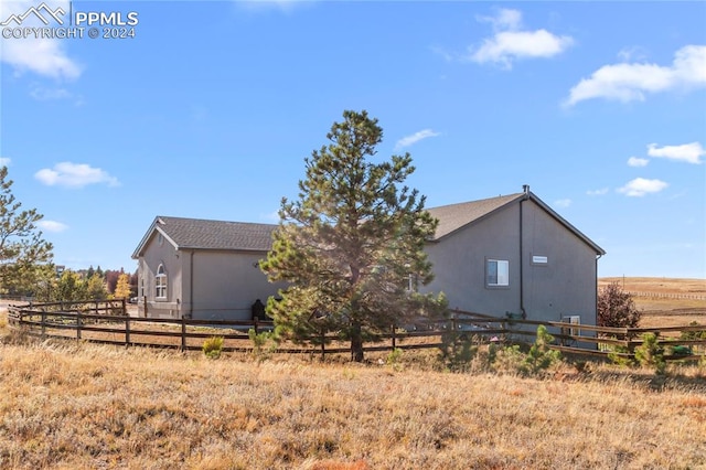 view of home's exterior featuring a rural view