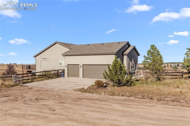 view of side of home with a garage