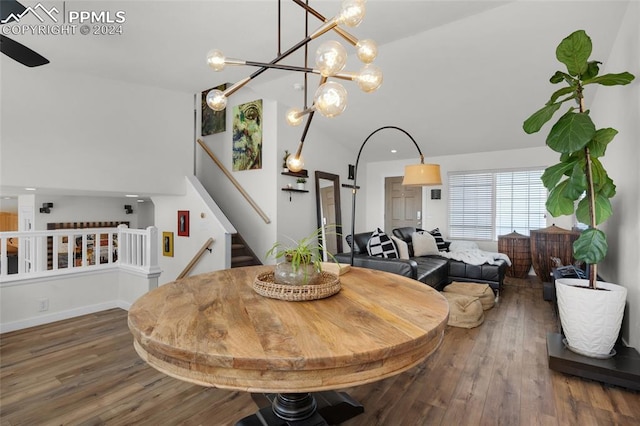 dining area featuring a notable chandelier and dark wood-type flooring