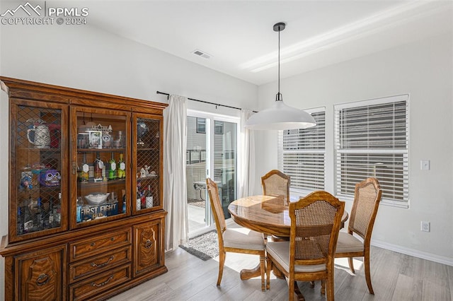 dining area with light hardwood / wood-style floors