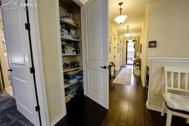 hall with dark hardwood / wood-style flooring