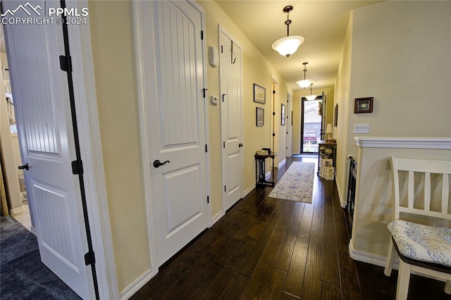 hall featuring dark wood-type flooring