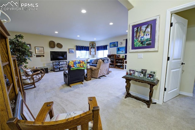 living room featuring light carpet