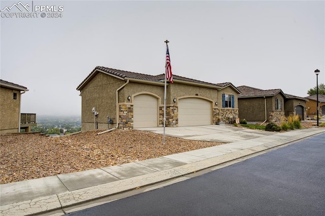 single story home featuring a garage