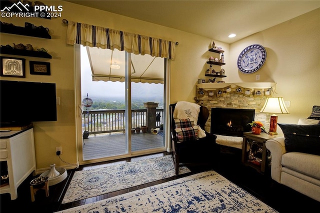 living room with a fireplace and hardwood / wood-style floors