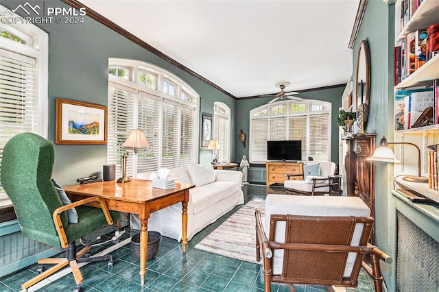 living room with dark tile patterned flooring, ceiling fan, and ornamental molding