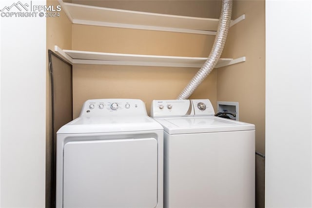 laundry room with independent washer and dryer