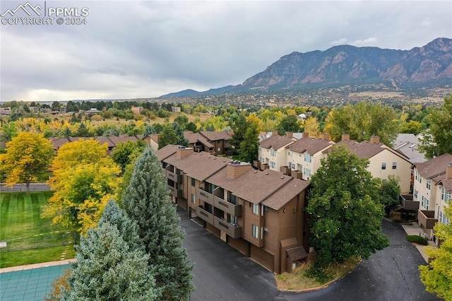 birds eye view of property with a mountain view