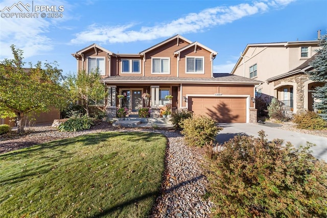 craftsman-style house with a front yard, a porch, and a garage