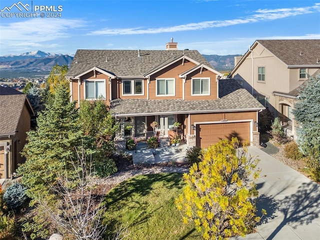 view of front of house featuring a mountain view and a garage