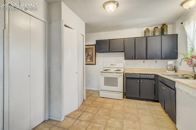 kitchen featuring white appliances and sink