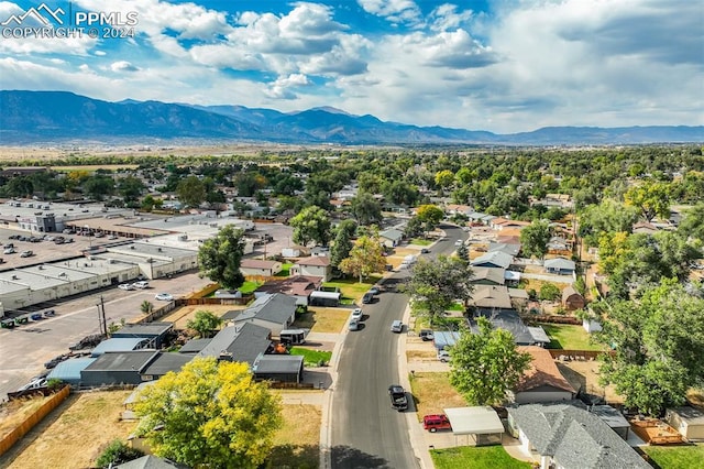 birds eye view of property featuring a mountain view