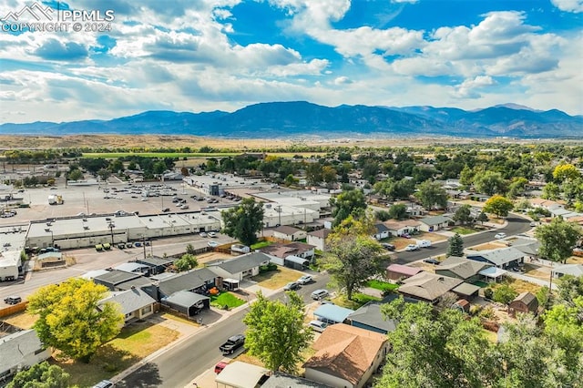 birds eye view of property featuring a mountain view