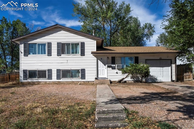 split level home featuring a garage