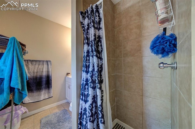 bathroom featuring vanity, curtained shower, and tile patterned floors