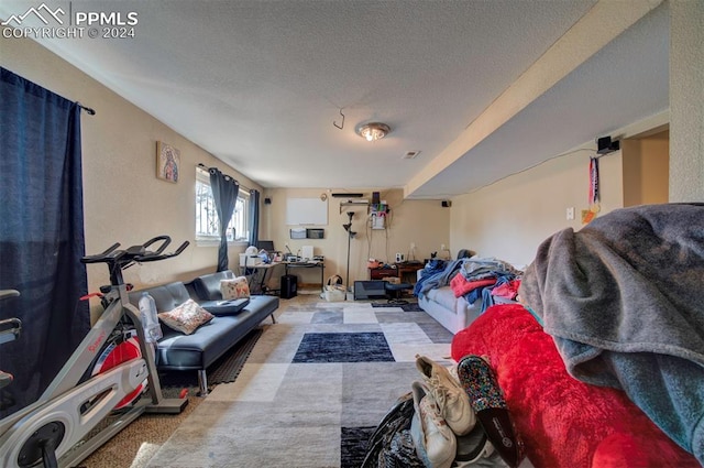 living room with light carpet and a textured ceiling