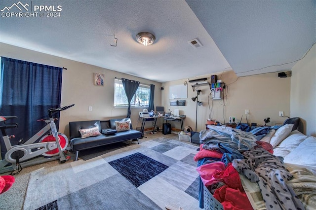 interior space with a textured ceiling and carpet flooring