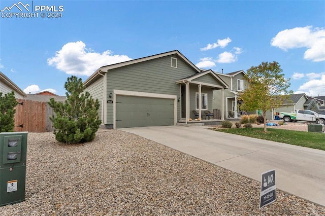 view of front of home with a garage and a porch