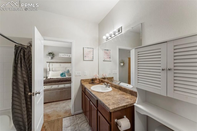 bathroom with vanity and shower / bath combo with shower curtain