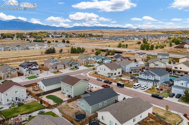 birds eye view of property with a mountain view