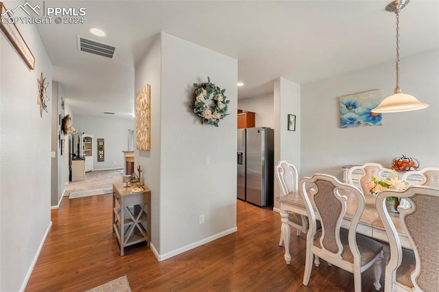 dining room with dark hardwood / wood-style floors