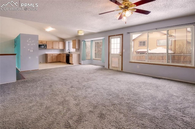 unfurnished living room with light carpet, a textured ceiling, ceiling fan, and lofted ceiling